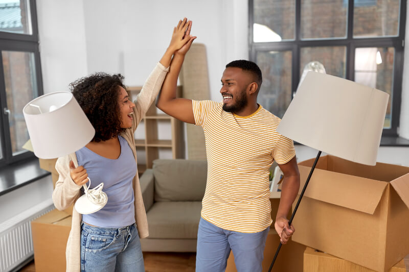 couple high five while packing